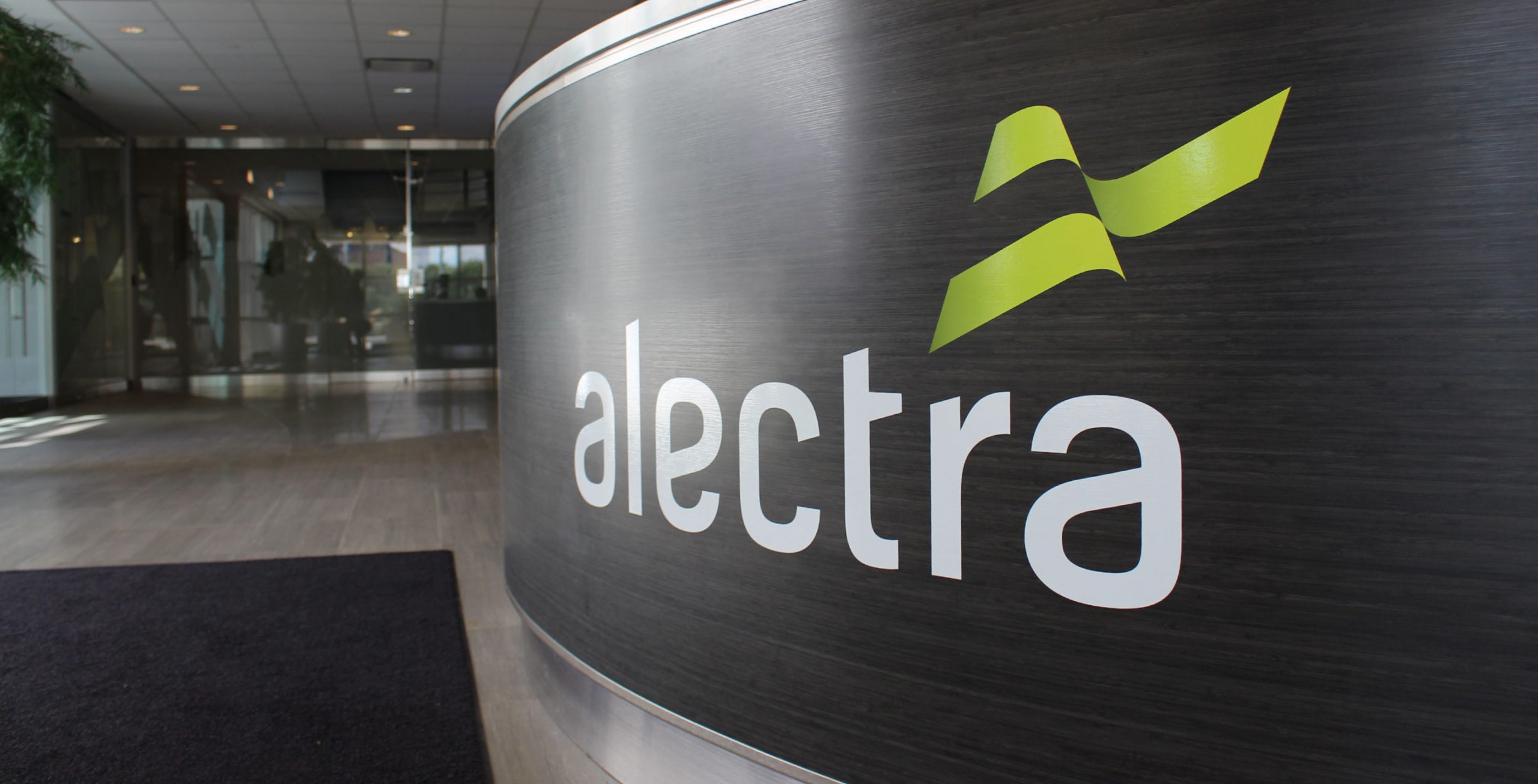The Alectra logo is featured on an curved metal interior application.