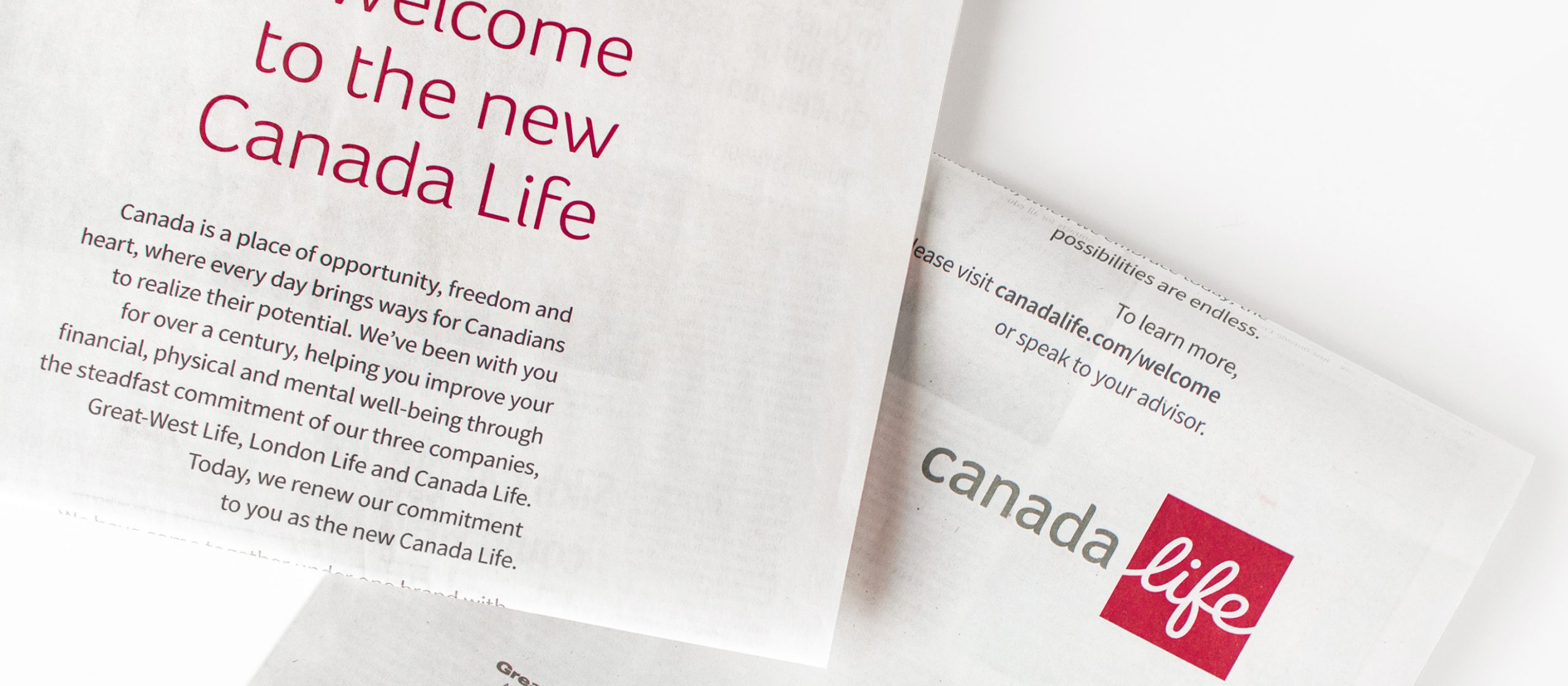 Full page ads in newsprint announcing the new Canada Life brand