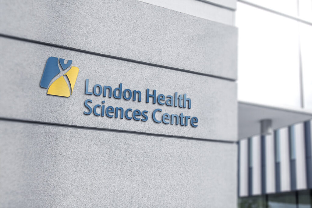 Photograph of LHSCs exterior signage on a concrete wall