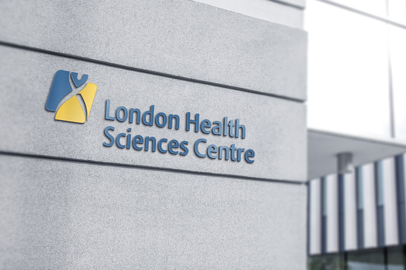 Photograph of LHSCs exterior signage on a concrete wall