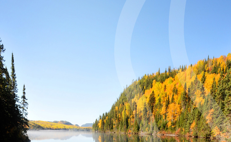 Fall scene of a lake and forest at the Sagard estate, in Québec