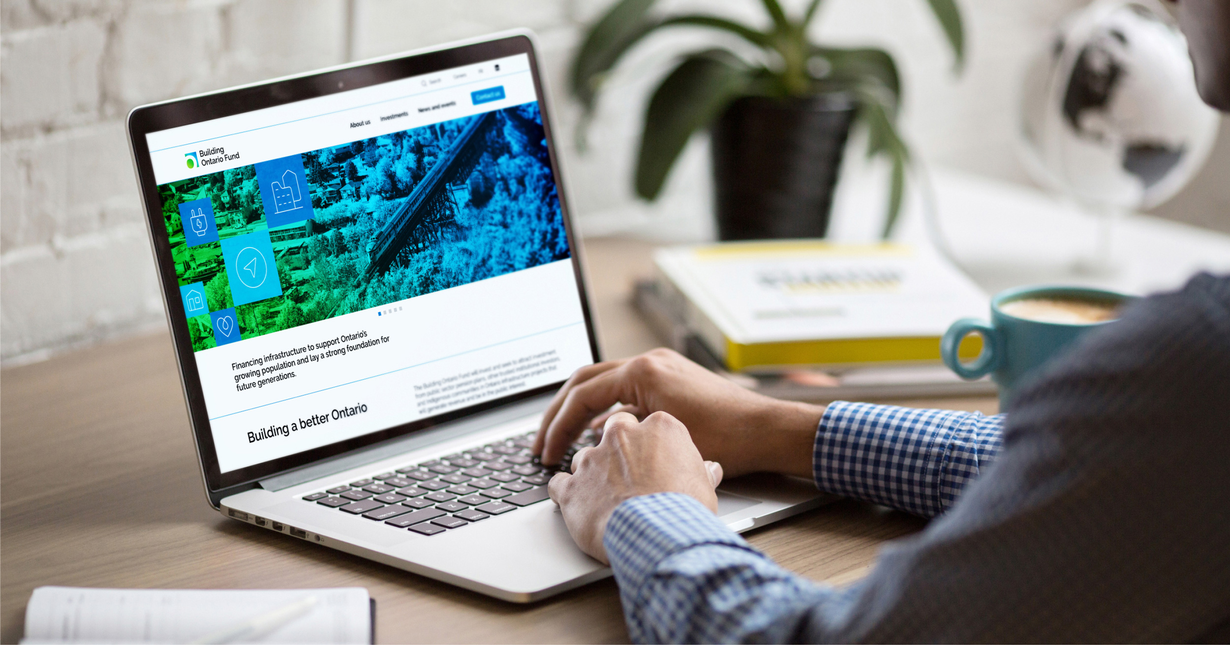 Image of a person scrolling through the BOF website on their laptop computer.