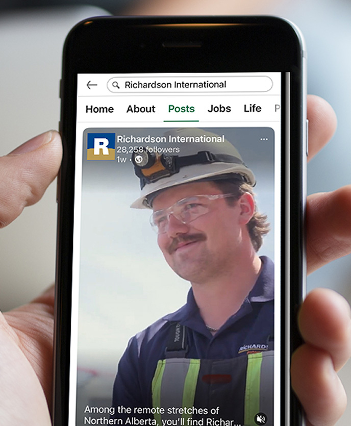 Closeup of a mobile phone displaying a Richardson's social post with their new favicon